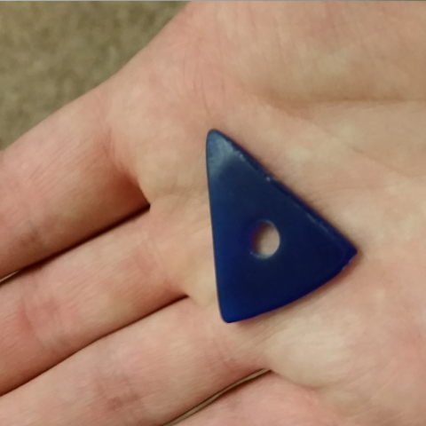 Blue triangle shapped guitar pick