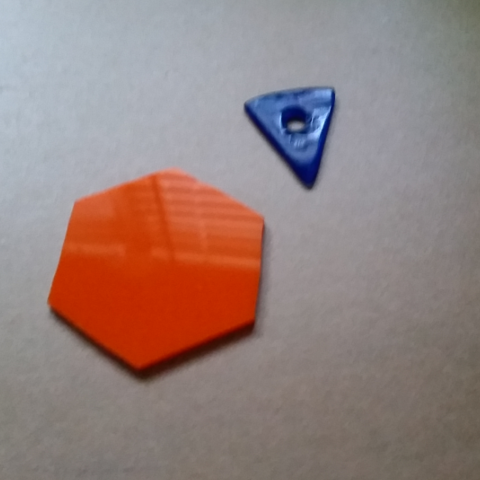 Polished pick and an orange hexagon